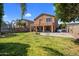 Expansive backyard featuring a covered patio, a basketball hoop, and a trampoline at 23945 N Pablo N Ct, Sun City, AZ 85373