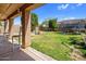 Spacious backyard with covered patio, grass, trampoline and basketball hoop at 23945 N Pablo N Ct, Sun City, AZ 85373