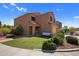 Two story home with desert landscaping, turf, and a covered porch with seating at 23945 N Pablo N Ct, Sun City, AZ 85373