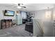 Upstairs loft with carpet, tv, seating and a desk workstation at 23945 N Pablo N Ct, Sun City, AZ 85373
