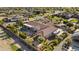 Aerial view displays a large private lot, RV parking, manicured lawn and a resort-style pool and entertainment area at 24695 S 195Th Way, Queen Creek, AZ 85142