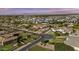 Scenic aerial view of a residential area featuring beautiful homes, mature trees, and mountain views at 24695 S 195Th Way, Queen Creek, AZ 85142