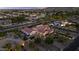 An aerial view shows the community, the home, and surrounding landscape at 24695 S 195Th Way, Queen Creek, AZ 85142