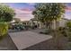 Spacious backyard featuring a covered patio, mature landscaping, and ample space for entertaining at 24695 S 195Th Way, Queen Creek, AZ 85142