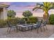 Relax around the custom gas firepit with pavers and professional landscaping in this backyard at 24695 S 195Th Way, Queen Creek, AZ 85142