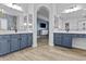 This spacious bathroom boasts dual vanities and is divided by a stylish archway at 24695 S 195Th Way, Queen Creek, AZ 85142