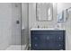 Modern bathroom features a sleek glass shower, a vanity with a stylish countertop and decorative towels at 24695 S 195Th Way, Queen Creek, AZ 85142