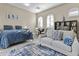 This well appointed suite offers a comfortable sitting area, queen bed, and dining table at 24695 S 195Th Way, Queen Creek, AZ 85142