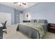 Serene bedroom with a large bed, soft lighting, and a calming blue accent wall at 24695 S 195Th Way, Queen Creek, AZ 85142