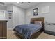A cozy bedroom features soft carpet, a comfortable bed, and ample natural light at 24695 S 195Th Way, Queen Creek, AZ 85142