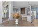 Eat-in kitchen area boasts wood-grain floors and contemporary light fixture at 24695 S 195Th Way, Queen Creek, AZ 85142