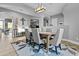 Elegant dining room with modern chandelier, dining table set and neutral color palette at 24695 S 195Th Way, Queen Creek, AZ 85142