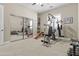 Exercise room with a mirrored closet door and a full set of weights at 24695 S 195Th Way, Queen Creek, AZ 85142