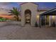 Exterior view of home with decorative entrance, palm trees, and covered patio area at 24695 S 195Th Way, Queen Creek, AZ 85142