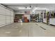 A well-organized garage with ample shelving, storage, and a clean, finished floor offering functionality and style at 24695 S 195Th Way, Queen Creek, AZ 85142