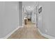 Long hallway features arched doorways and wood-look floors at 24695 S 195Th Way, Queen Creek, AZ 85142