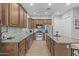 Kitchen featuring granite countertops, stainless steel appliances, and custom cabinets at 24695 S 195Th Way, Queen Creek, AZ 85142