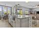 Island kitchen features stainless steel sink, granite countertops, and modern cabinetry at 24695 S 195Th Way, Queen Creek, AZ 85142