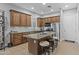 Beautiful kitchen featuring a center island, stainless appliances, and custom cabinets at 24695 S 195Th Way, Queen Creek, AZ 85142