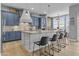 Bright kitchen with an island, modern appliances, and pendant lighting over seating at 24695 S 195Th Way, Queen Creek, AZ 85142