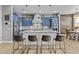 Modern kitchen with an island, seating, stainless steel appliances, and ample cabinet space at 24695 S 195Th Way, Queen Creek, AZ 85142