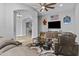 Comfortable living area with a large television, plush seating, and an open floor plan at 24695 S 195Th Way, Queen Creek, AZ 85142