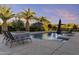 Enjoy the sun poolside, surrounded by lush landscaping and relaxing lounge chairs at 24695 S 195Th Way, Queen Creek, AZ 85142