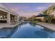 Sparkling pool and covered patio provide an ideal space for outdoor relaxation and entertainment at 24695 S 195Th Way, Queen Creek, AZ 85142