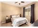 Bedroom showcasing a full bed, neutral colored walls, one large window, and ceiling fan at 25862 N 108Th Ave, Peoria, AZ 85383