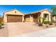 Charming single-story home with a three-car garage, tile roof, desert landscaping and paver driveway at 25862 N 108Th Ave, Peoria, AZ 85383