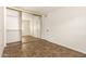 This bright bedroom features a large closet and tile flooring at 27 W Concorda Dr # 104, Tempe, AZ 85282