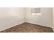 This bright bedroom features a window and tile flooring at 27 W Concorda Dr # 104, Tempe, AZ 85282
