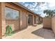 Spacious patio featuring brick walls, offering privacy and shade for outdoor activities at 27 W Concorda Dr # 104, Tempe, AZ 85282