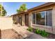 Inviting single-story home entrance featuring front door, landscaping, and walkway at 27 W Concorda Dr # 104, Tempe, AZ 85282