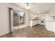 Bright kitchen area featuring tile flooring, white appliances, and a sliding door to the outdoor patio at 27 W Concorda Dr # 104, Tempe, AZ 85282
