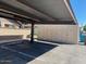 Exterior parking at a carport with labeled unit storage at 27 W Concorda Dr # 104, Tempe, AZ 85282