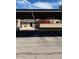 View of assigned covered parking with colorful plants and blue skies at 27 W Concorda Dr # 104, Tempe, AZ 85282