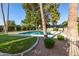 Enjoy the community pool with trees and lush landscaping at 27 W Concorda Dr # 104, Tempe, AZ 85282