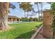 Beautiful pool area with lush green grass and a covered seating area for relaxing and entertaining at 27 W Concorda Dr # 104, Tempe, AZ 85282