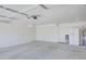 Spacious, clean garage featuring bright lighting, painted walls, and ample storage potential at 2806 E Pontiac Dr, Phoenix, AZ 85050