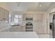 Spacious kitchen with stainless steel appliances, ample counter space, and bright, natural light at 2806 E Pontiac Dr, Phoenix, AZ 85050