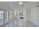 Large tile floored living room with views to both the backyard and kitchen at 2806 E Pontiac Dr, Phoenix, AZ 85050