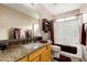 Bathroom featuring a granite countertop, a large mirror, and a shower-tub combo at 3017 W Matthew Dr, Phoenix, AZ 85027