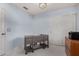 Bright bedroom shows ample natural light, neutral carpet, closet with sliding doors, and stylish ceiling light at 3017 W Matthew Dr, Phoenix, AZ 85027