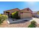 Quaint home with a tiled roof and landscaped front yard on a sunny day at 3017 W Matthew Dr, Phoenix, AZ 85027