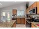 Kitchen showcasing granite countertops, stainless steel appliances, and warm-toned cabinetry at 3017 W Matthew Dr, Phoenix, AZ 85027