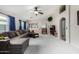 Bright living room with vaulted ceilings, a comfortable gray sectional, and open archways at 3017 W Matthew Dr, Phoenix, AZ 85027