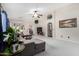 Spacious living room with vaulted ceilings and neutral carpet and large gray sectional at 3017 W Matthew Dr, Phoenix, AZ 85027