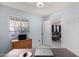 Bright office with view to living room with large window and desk, perfect for working at home at 3017 W Matthew Dr, Phoenix, AZ 85027