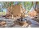 Exterior community space with mature trees and fountain at 3031 N Civic Center Plz # 255, Scottsdale, AZ 85251